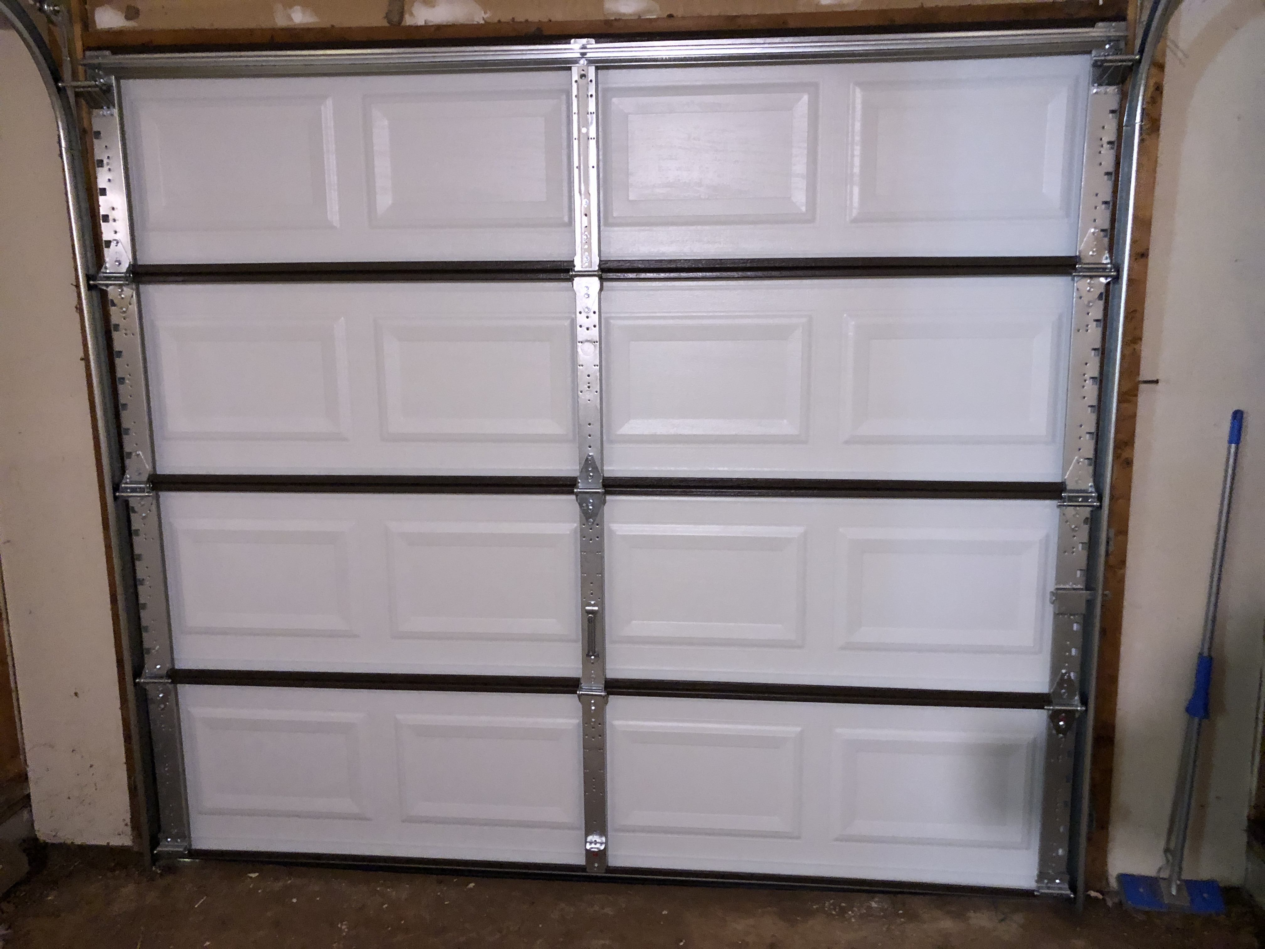 Sectional garage door panel replacement