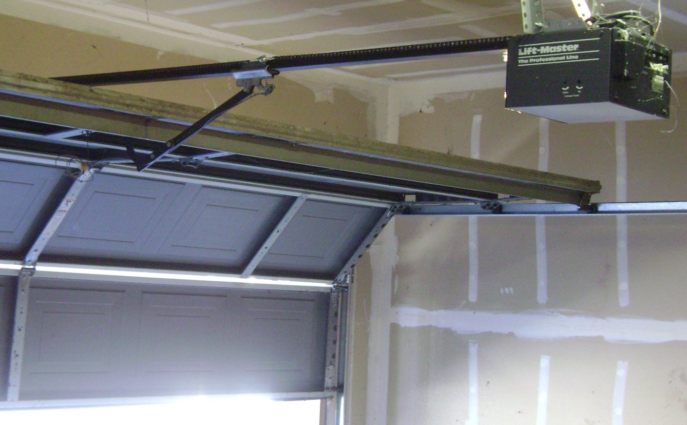 Garage door opener motor and rail repair